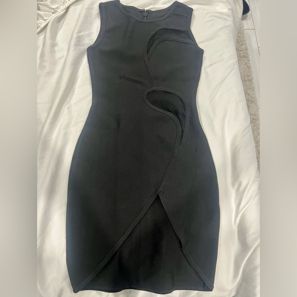 Sexy black mini dress with sheer cutouts and a slit